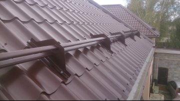 стоимость установки снегозадержателя